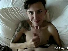 Emo teen boy engages in bareback gay sex with young partner, capturing cum on cock in video