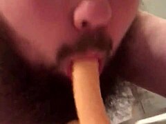 Young gay chub teases while sucking and riding dildo.