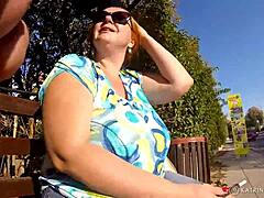 BBW Woman with Natural Features Enjoys Public Nudity in Relaxed Setting