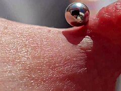 Close up of pierced nipples on a hot European milf on the balcony