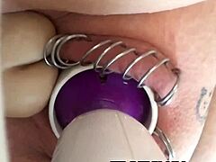 Hot girl with pierced vagina using sex toys for pleasure