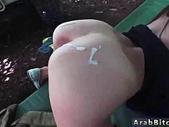 Uniformed Arab mistress uses strapon outside in the woods