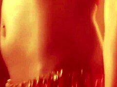 sexy oriental woman performs exotic belly dance with flair