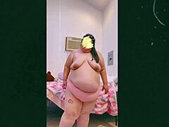 Mature woman dances topless on webcam