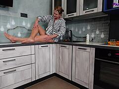 Mature redhead Iris teases with legs in tan pantyhose