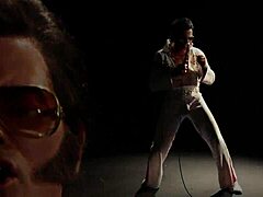 Blonde in Elvis parody engages in MMF threesome with blowjob and spitting