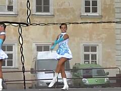 Two nice majorettes performing in their cheerleader outfits