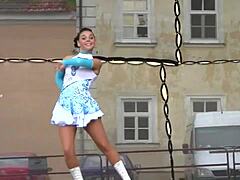 Two nice majorettes performing in their cheerleader outfits
