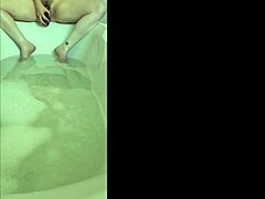 Solo bath leads to horny orgasm.