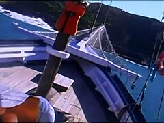 Sensual lesbian intercourse on boat with feet and kissing