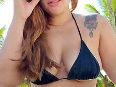 She wears a short bikini to the beach