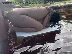 Hot brunette fucks in lake.