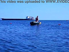 Mature woman in bikini on Volga River boat