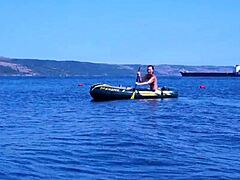 Mature woman in bikini on Volga River boat