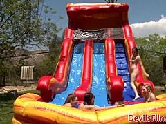 i toy lesbian beauties' pussies outdoors with strapon