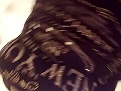 bbw woman teases with ripped clothes in retro film.