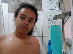 Gorgeous Latina brunette shows off her wet pussy while taking a shower