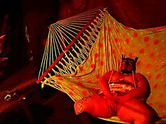 getting frisky in a tent fingering her wet hole in a hammock