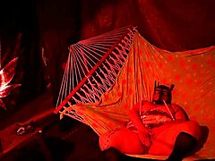 getting frisky in a tent fingering her wet hole in a hammock