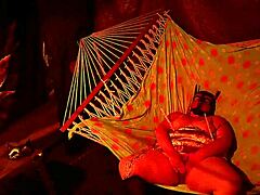 getting frisky in a tent fingering her wet hole in a hammock