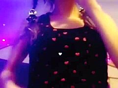 Seductive babe smokes cigarette while performing slow striptease, ripping clothes off provocatively