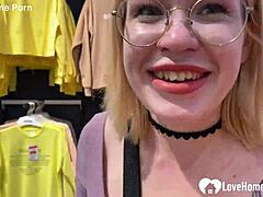 Blonde Girlfriend with Glasses and Lipstick Gives Blowjob and Cumshot in Shop Changing Booth