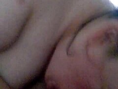 My girlfriend gives a blowjob while fingering herself.