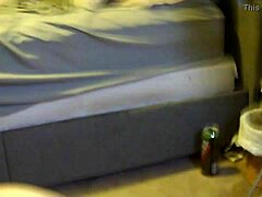 Girlfriend kneels for oral sex in front of the desk.