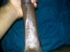Feeling so aroused while stroking my massive black cock alone at home.