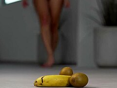petite brunette girl casually crushes fruits with high heels in hot footfetish solo scene, showing off her feet and shoes softly