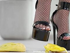 petite brunette girl casually crushes fruits with high heels in hot footfetish solo scene, showing off her feet and shoes softly