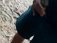 exhibitionist couple fucks on public beach while stranger joins for cumshot oral action