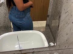 She fingered her big juicy pussy in the shopping mall bathroom until creamy juices dripped out