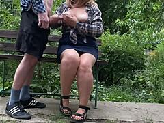 In this amateur scene my mother-in-law's big natural tits get covered in my cum outdoors