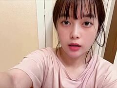 Japanese brunette college girl masturbates with her hairy pussy after gym workout, feeling intense emotions.