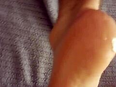 Cumshot aftermath lingers on DirtySocks' feet in this subtle fetish display.