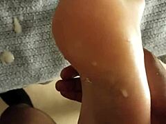 Cumshot aftermath lingers on DirtySocks' feet in this subtle fetish display.