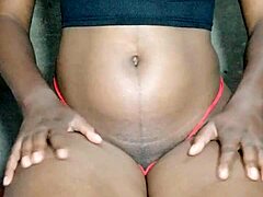 Ebony Displays Pussy While Playing With Her Tits Intensely