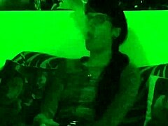beth kinky as sexy goth domina smokes cigarette in green light hd