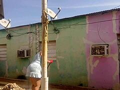 Mexican mature latina with big ass teases neighbor flashing in short dress outdoors.