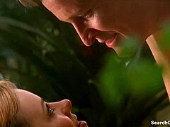 Camille Keenan teases with subtle big tits allure in Satisfaction S03E09 2010 scene.