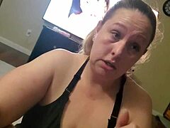 Curvy blonde housewife with big tits gives deepthroat handjob to husband. She teases with dirty talk while sucking cock.