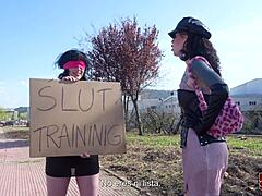 Bdsm scene where Emmita misbehaves outdoors, getting bound and punished by Fedora with strapon domination and handjob on big cock