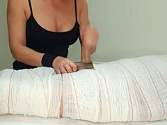 mummified handjob erupts cum after two minute tease!