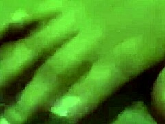 A woman indulges in solo female masturbation privately at home