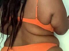 Ebon milf slut shakes big tits and ass in horny bikini dance tease