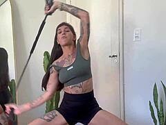 ever tried rubber band yoga with an inked fitness babe?