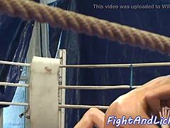 Oiled lesbian babes finger and lick during hot wrestling match