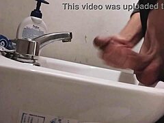 skinny dude rests huge balls on sink preps monster cock for massive cumshot