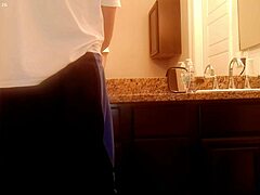 asian amateur tidies bathroom during house chores